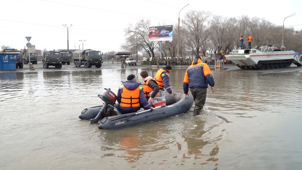 Rescuers ride a boat in a flooded street of Orsk, Russia April 9, 2024, in this still image taken from video. — Screen capture via Reuters TV via Reuters