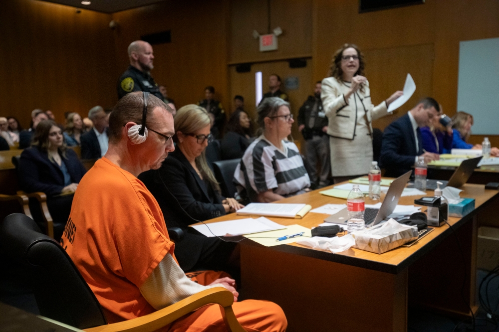 (From left) James Crumbley, his attorney Mariell Lehman, Jennifer Crumbley, and her attorney Shannon Smith, sit in court for sentencing on four counts of involuntary manslaughter for the deaths of four Oxford High School students who were shot and killed by the Crumbley parents' son, at Oakland County Circuit Court in Pontiac, Michigan April 9, 2024. — Picture by Bill Pugliano/ Getty Images via AFP 