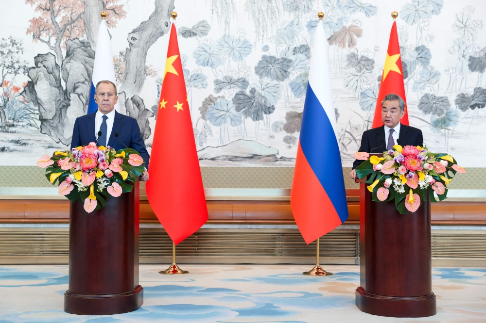This handout picture taken and released by the Russian Foreign Ministry on April 9, 2024 shows Russian Foreign Minister Sergei Lavrov and China's Foreign Minister Wang Yi holding a joint press conference following their talks in Beijing. — Handout by Russian Foreign Ministry via AFP 