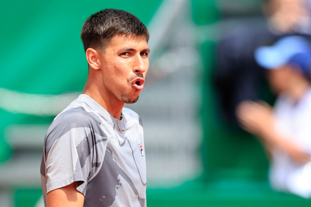 Australia's Alexei Popyrin celebrates after winning against Russia's Andrey Rublev during their Monte Carlo ATP Masters Series Tournament round of 32 tennis match on the Rainier III court at the Monte Carlo Country Club April 10, 2024. — AFP pic
