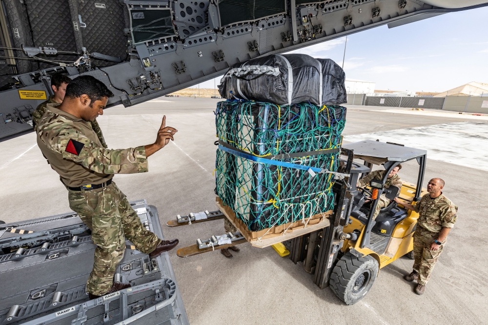British Army personnel from 47 Air Despatch Squadron load humanitarian aid onto an A400M Atlas military plane as part of an action to address the plight of Palestinian people in Gaza, at an unspecified location in Jordan April 9 2024. — Picture by UK MOD/Handout via Reuters