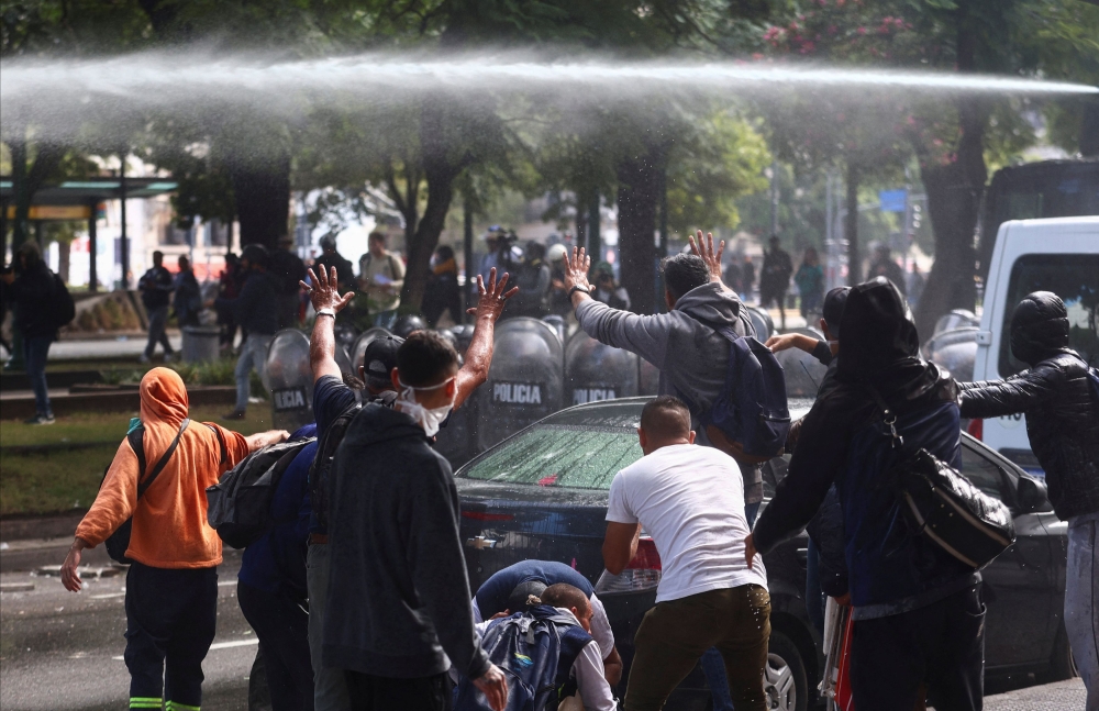 Police use a water cannon as demonstrators protest against Argentine President Javier Milei's economic plan, and in demand of resources for soup kitchens and assistance, in Buenos Aires April 10, 2024. — Reuters pic