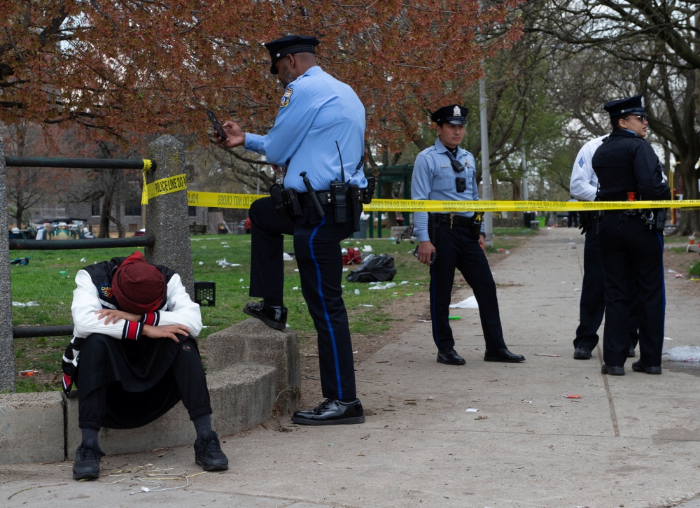Police and law enforcement officers secure the area of a shooting that took place during an Eid event being held at Clara Muhammad Square in West Philadelphia April 10, 2024. — Reuters pic