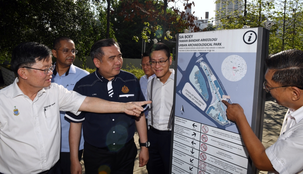 Chief Minister Chow Kon Yeow (left) shows the planned location of the Penang LRT station to Transport Minister Anthony Loke during a working visit to inspect the LRT station construction site in George Town May 30, 2023. — Bernama pic