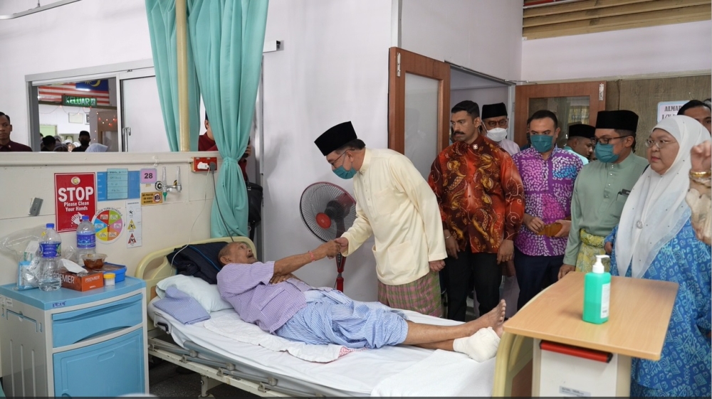 Prime Minister Datuk Seri Anwar Ibrahim (centre) greets a patient during a visit to Hospital Kuala Lumpur April 11, 2024. — Screen capture of video courtesy of Prime Minister’s Office