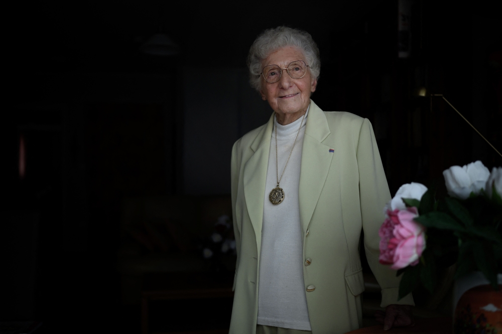 Melanie Berger-Wolle poses at her home in Saint-Etienne on March 26, 2024. The 102 years old multi honoured resistance fighter during WWII is supposed to hold the Olympic Torch in June. — AFP pic