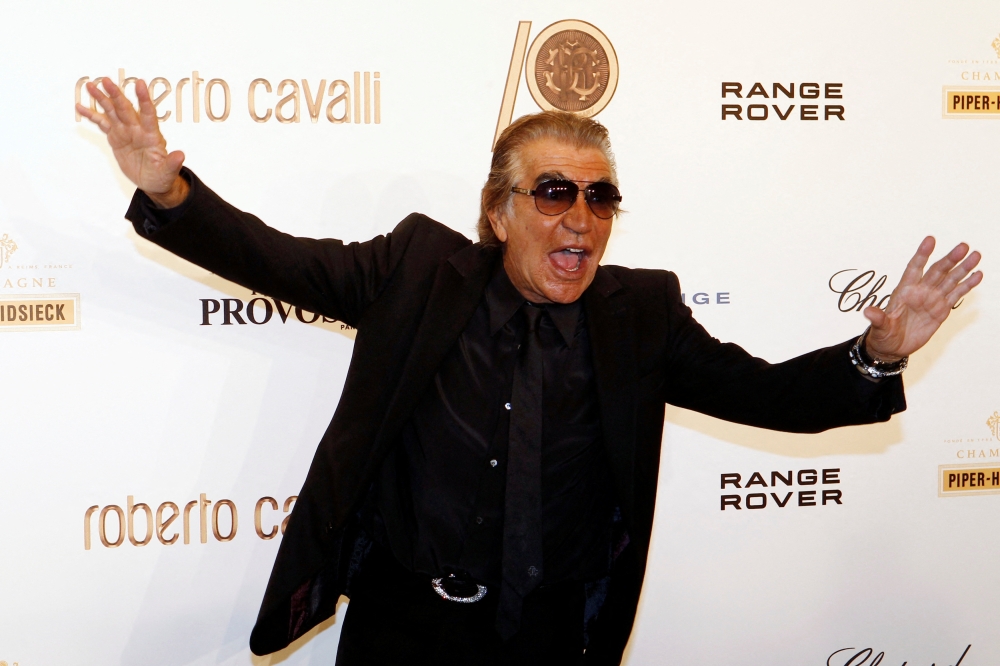 Roberto Cavalli, who used bright colours and patchwork effects in his often revealing creations, was an extroverted art lover who wore tinted glasses and smoked a cigar. ― Reuters file pic