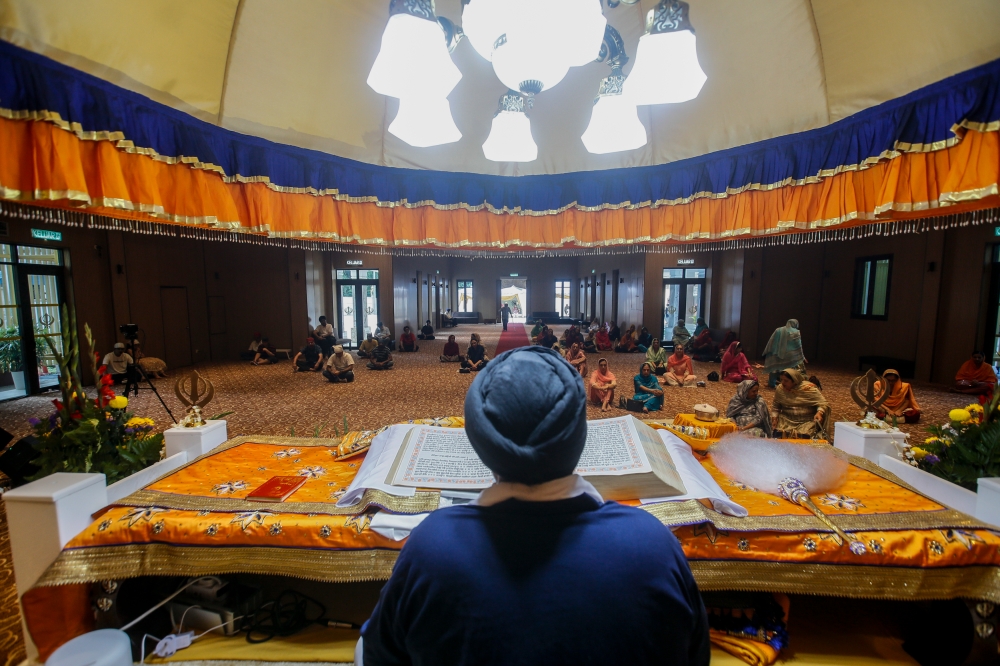 At Gurdwara Sahib Sentul, the Vaisakhi celebrations begin with a 48-hour recitation of the Sri Guru Granth Sahib — the 1,430-page Sikh holy scripture. — Picture by Hari Anggara