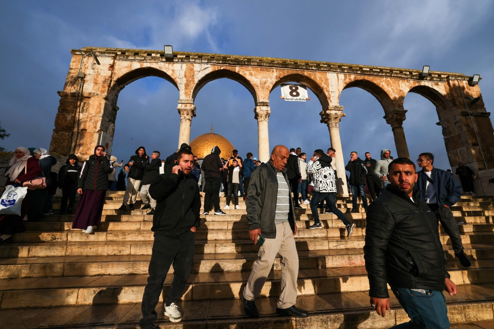 Muslims leave after offering special morning prayers to start the Eid al-Fitr festival, which marks the end of the holy fasting month of Ramadan, at the Al-Aqsa Mosque compound in Jerusalem on April 10, 2024. — AFP pic