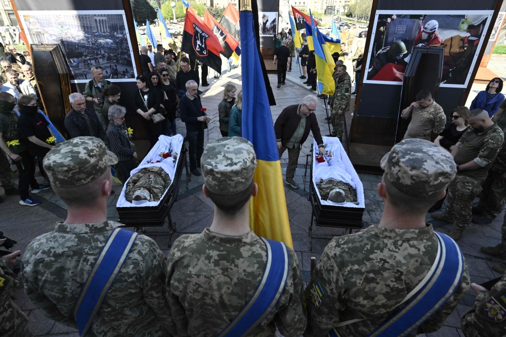 File photo of relatives, friends and comrades paying last respect during farewell ceremony for Ukrainian servicemen who were killed fighting Russian troops in Donetsk region, at the Independence Square in Kyiv, on April 9, 2024, amid the Russian invasion of Ukraine. — AFP pic