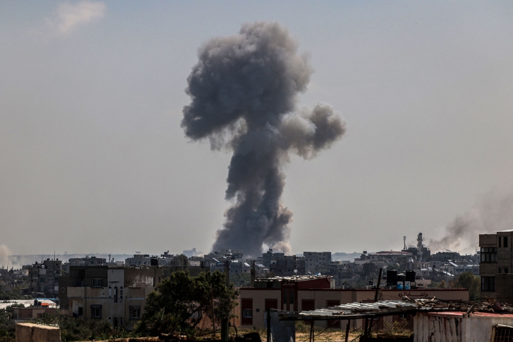 Smoke rises following Israeli bombardment in Nuseirat, central Gaza. — AFP pic