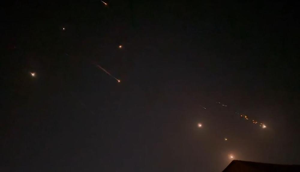 This video grab from AFPTV taken on April 14, 2024 shows explosions lighting up the sky in Hebron. — AFP pic