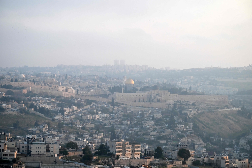 This view of Jerusalem’s Old City was captured at dawn of April 14, 2024, after Iran launched a drone and missile attack on Israel. — AFP pic