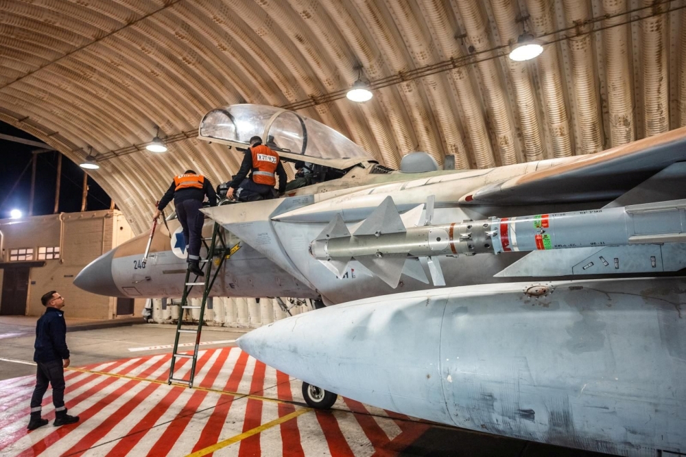 Crews work on an Israeli Air Force F-15 Eagle in a hangar, said to be following an interception mission of an Iranian drone and missile attack on Israel, in this handout image released April 14, 2024. — Israel Defence Forces handout via Reuters