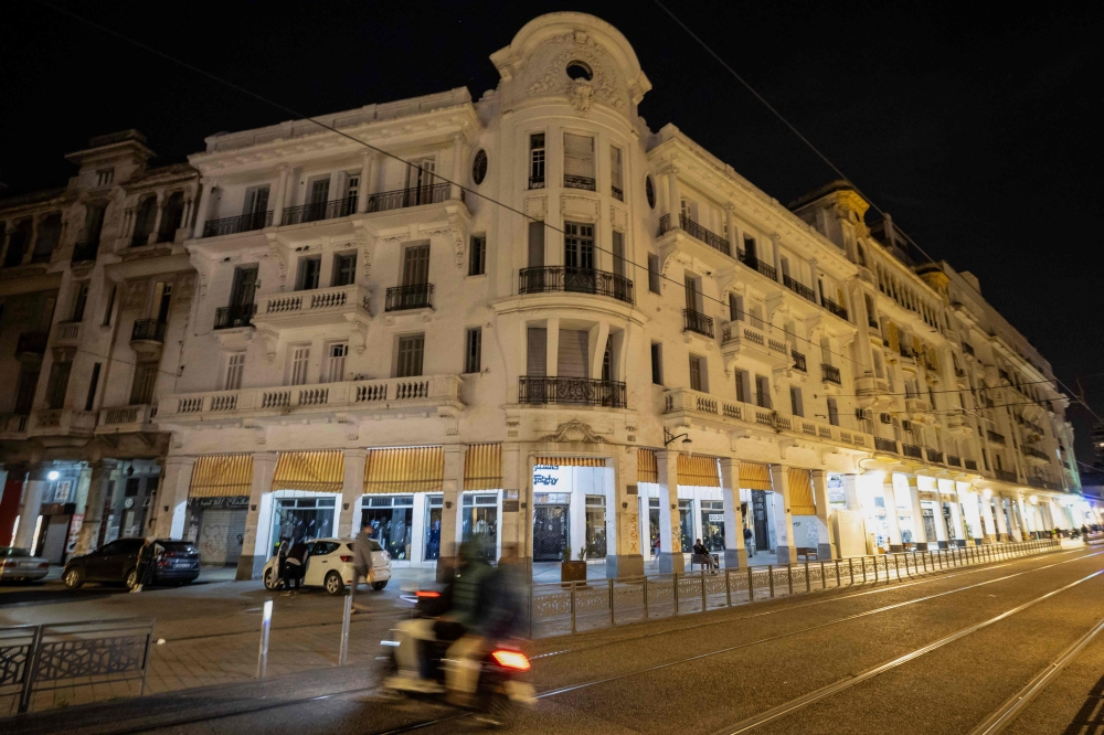 A picture shows a view of a building with distinguished architecture in the city of Casablanca on March 29, 2024. For architecture fans, Casablanca offers a visual feast of Moorish tiles, ancient minarets and French colonial facades with Art Deco touches, but much still faces dereliction or is falling apart. — AFP pic
