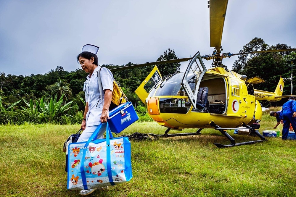 A Flying Doctor Service nurse visits a rural area. — Photo via Facebook/World Health Organisation Western Pacific Region
