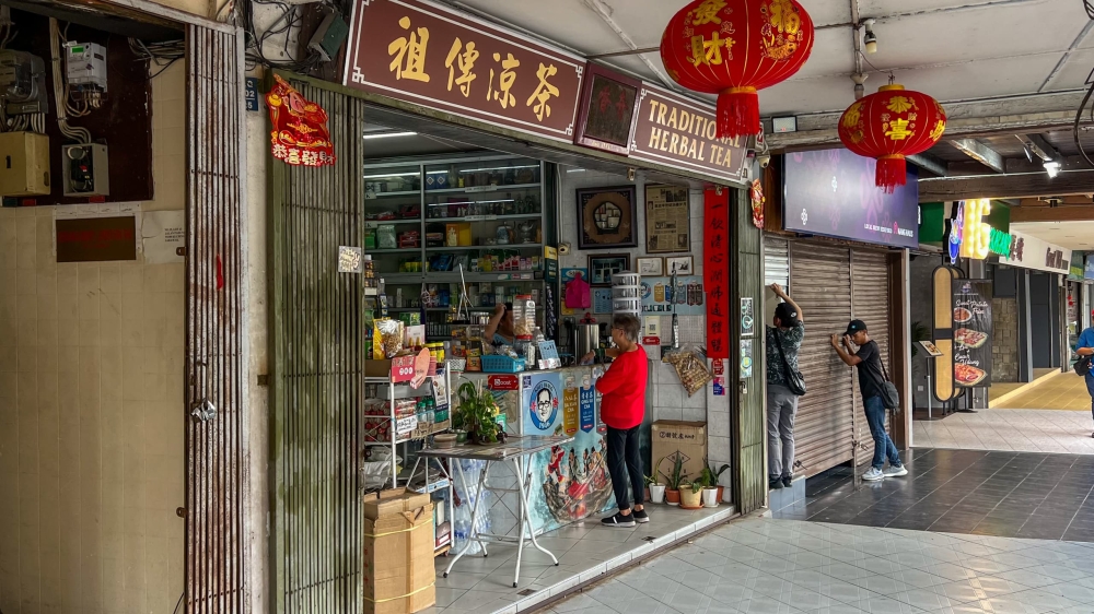 The traditional herbal tea shop, which is the inspiration for Siaw’ third mural masterpiece. — Picture by Roystein Emmor via The Borneo Post