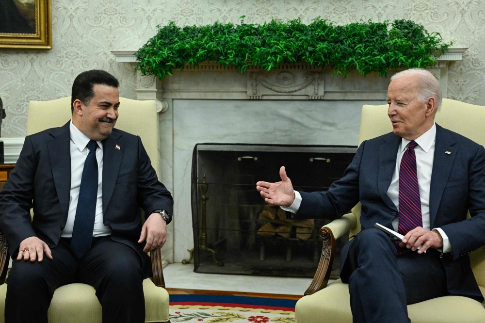 US President Joe Biden and Iraq’s Prime Minister Mohamed Shia al-Sudani said yesterday they would keep working towards the withdrawal of a US-led anti-jihadist coalition in the country. — AFP pic