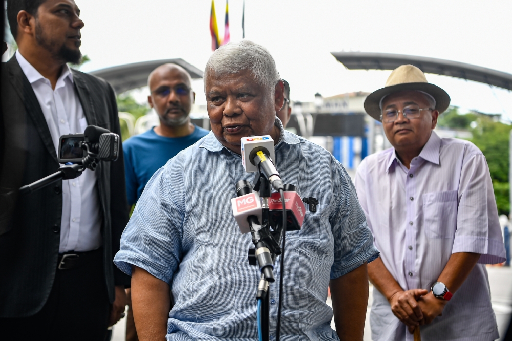 Former Batu Berendam Member of Parliament Datuk Mohd Tamrin Abdul Ghafar speaks to the media at Bukit Aman, April 16, 2024. — Bernama pic 