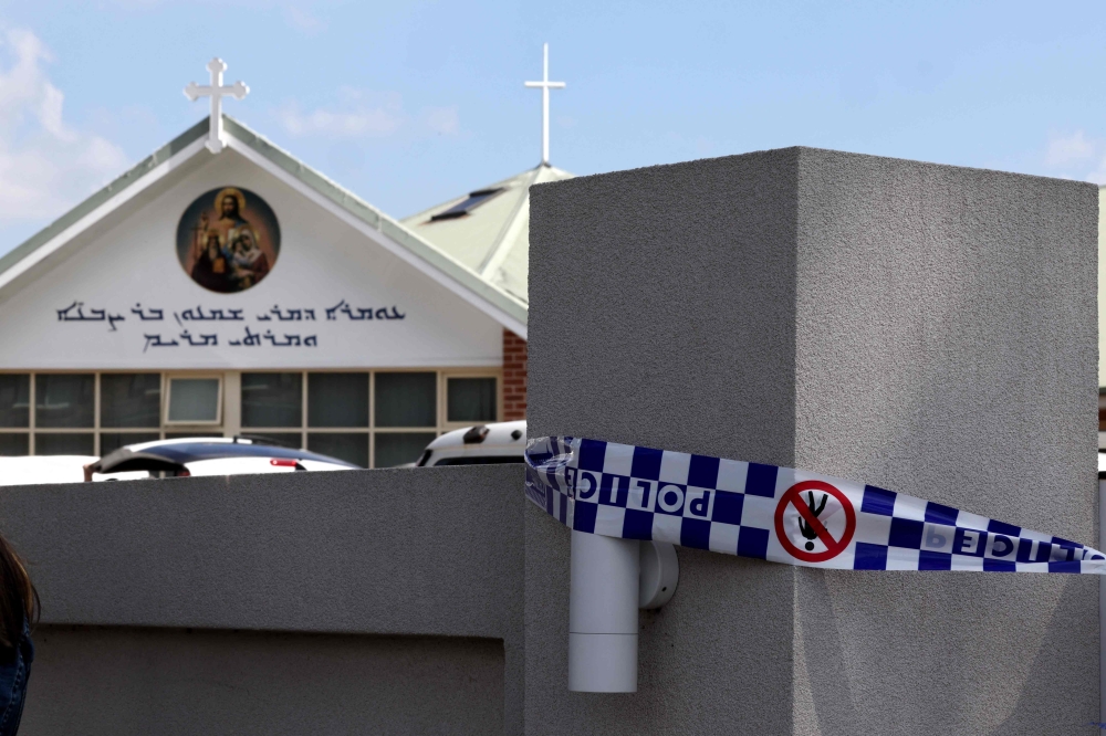 Police tape covers the main gate of the Christ the Good Shepherd Church in Sydney's western suburb of Wakeley on April 16, 2024. — AFP pic
