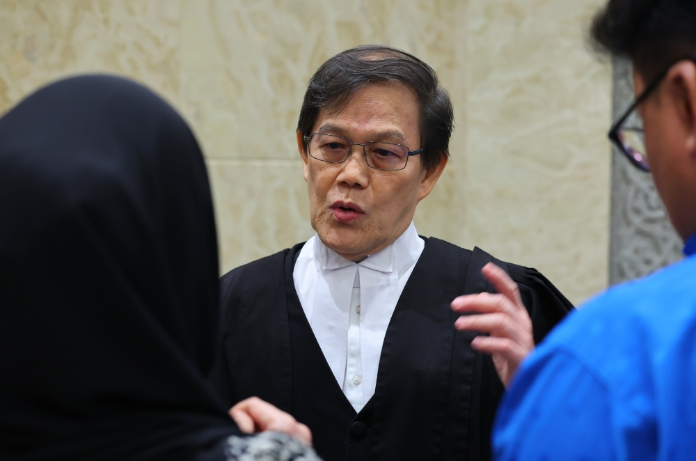 Lawyer Datuk Hisyam Teh Poh Teik, representing Muhammad Najib Mohd Razi, speaks to the media at the Court of Appeal in Putrajaya April 18, 2024. — Bernama pic