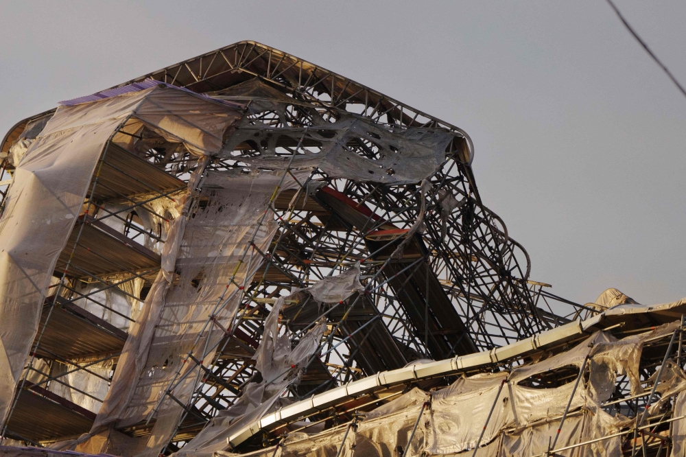 This photograph taken on April 17, 2024 shows a view of the historic Boersen Stock Exchange, a day after a fire ravaged the building, which was under renovation, and toppled its iconic spire in Copenhagen. — AFP pic