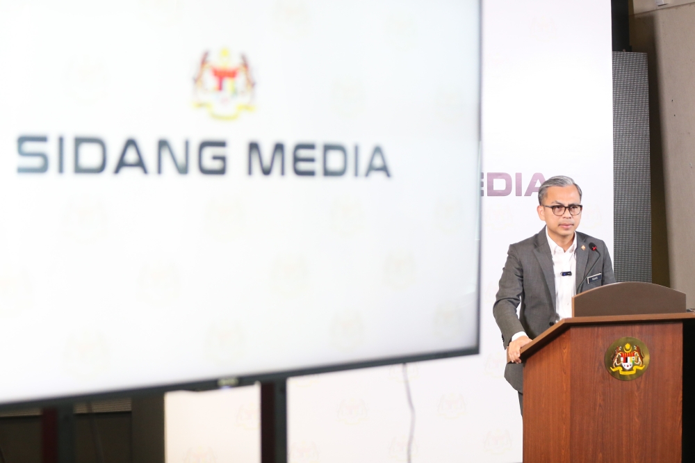 Communications Minister Fahmi fadzil speaks during the weekly press conference in Putrajaya on April 17, 2024. — Picture by Miera Zulyana