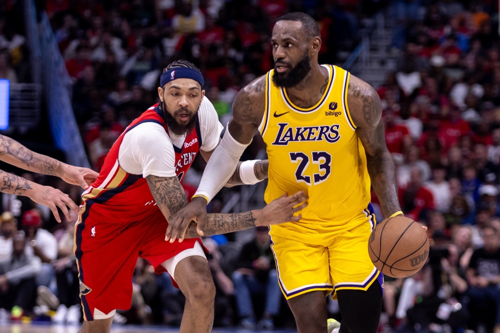 Los Angeles Lakers forward LeBron James dribbles against New Orleans Pelicans forward Brandon Ingram during the second half of a play-in game of the 2024 NBA playoffs at Smoothie King Center, New Orleans, Louisiana, April 16, 2024. — Stephen Lew-USA TODAY Sports pic via Reuters 