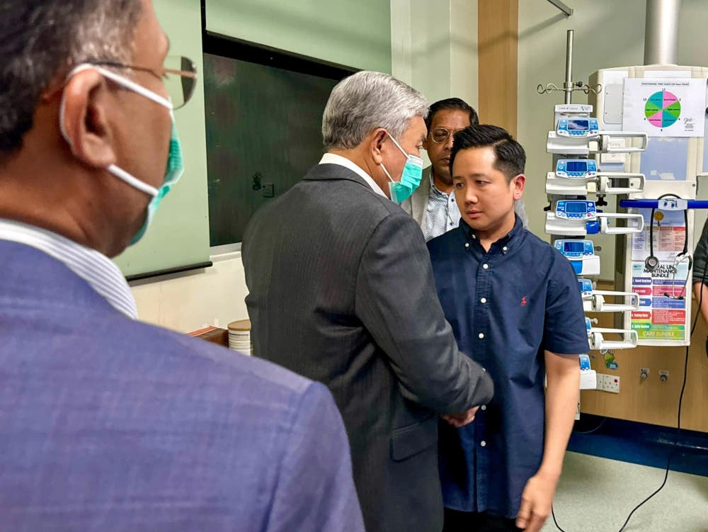 Deputy Prime Minister Datuk Seri Ahmad Zahid Hamidi speaks to Deputy Minister of Agriculture and Food Security Datuk Arthur Joseph Kurup at the National Heart Institute in Kuala Lumpur, April 17, 2024. — Picture from Facebook/Zahid Hamidi