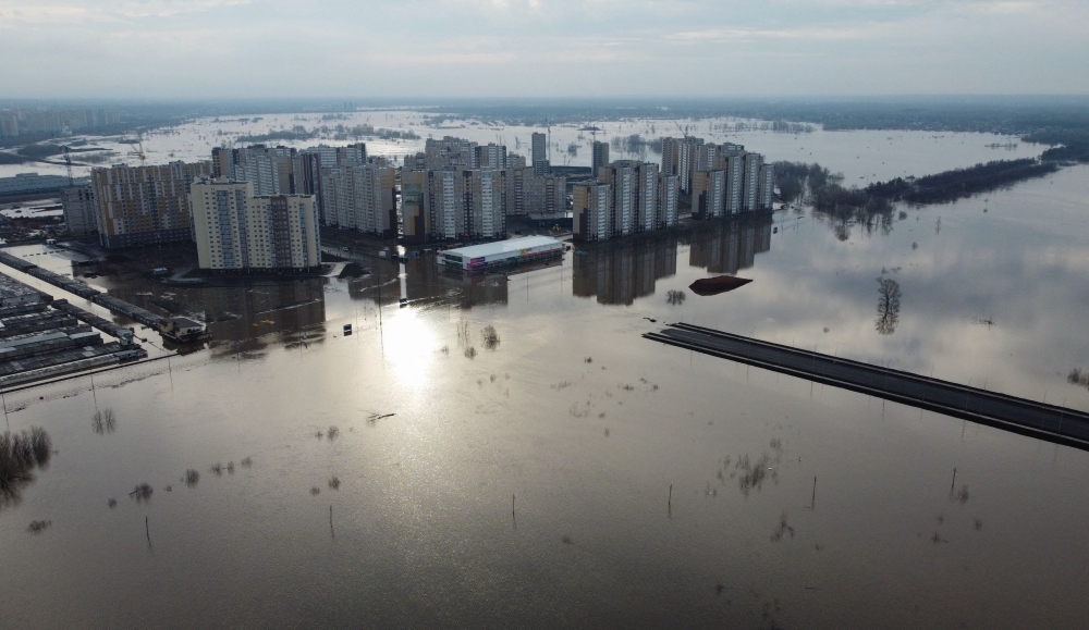 Thousands of homes in swathes of Russia have been affected by the floods. This aerial view show the flood-hit city of Orenburg on April 13, 2024. — AFP pic