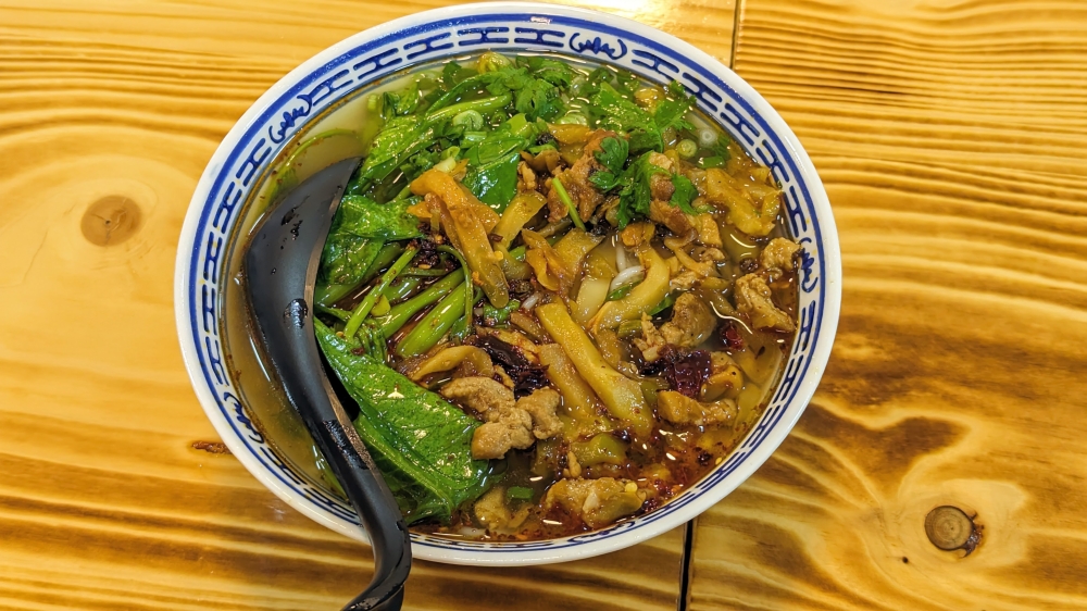 Spicy pickled shredded meat rice noodles is a great one-bowl meal.