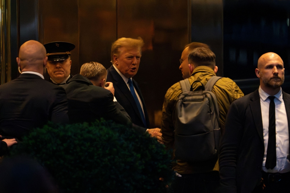 Republican presidential candidate and former US President Donald Trump greets Polish President Andrzej Duda at Trump Tower in New York, April 17, 2024. — Reuters pic