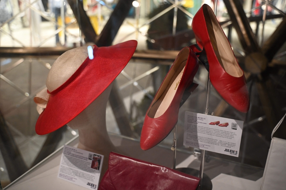 Photo taken on April 17, 2024 shows shoes and accessories once worn by Princess Diana at a media preview ahead of the auction by Julian’s Auctions titled ‘Princess Diana’s Elegance & A Royal Collection’ on display in Hong Kong. — AFP pic