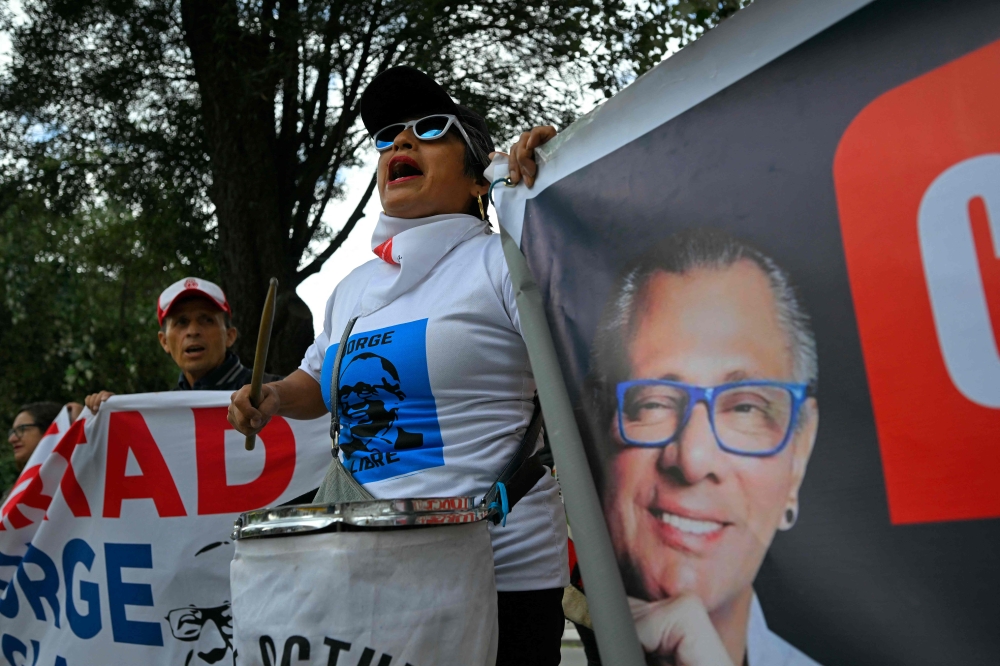 Supporters of former Ecuadorean vice president Jorge Glas demonstrate outside the National Court of Justice during the court hearing for his habeas corpus in Quito on April 12, 2024. — AFP pic