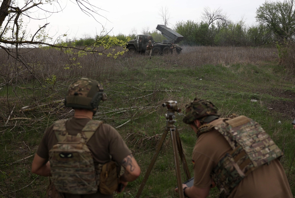 Ukrainian gunners of the 14th Separate Mechanised Brigade named after Prince Roman the Great prepare to fire at the enemy with BM 21 
