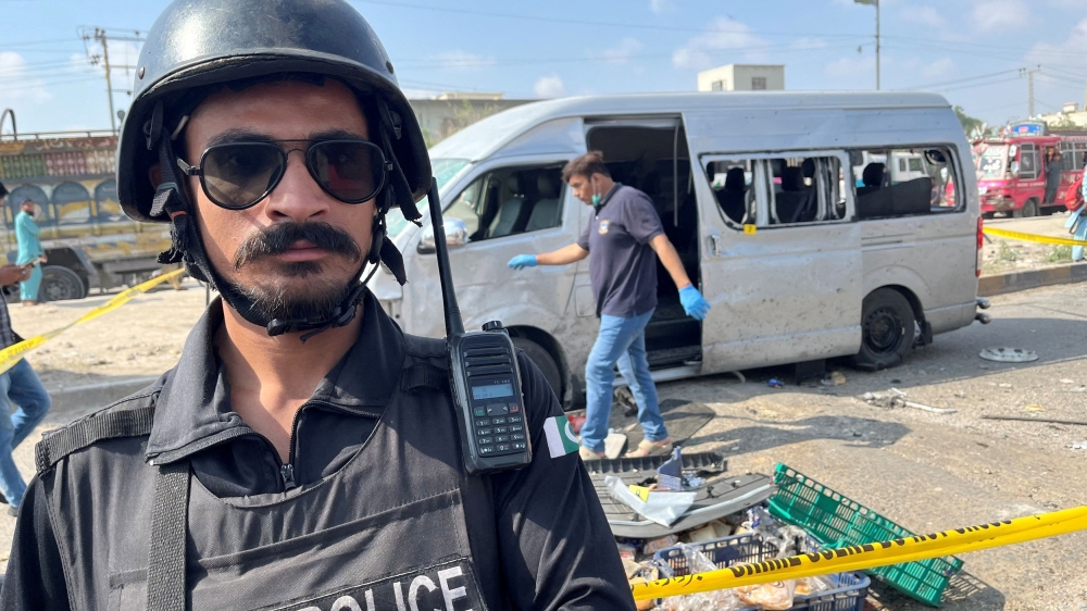 A police officer stands guard at the site after a suicide blast in Karachi April 19, 2024. — Reuters pic