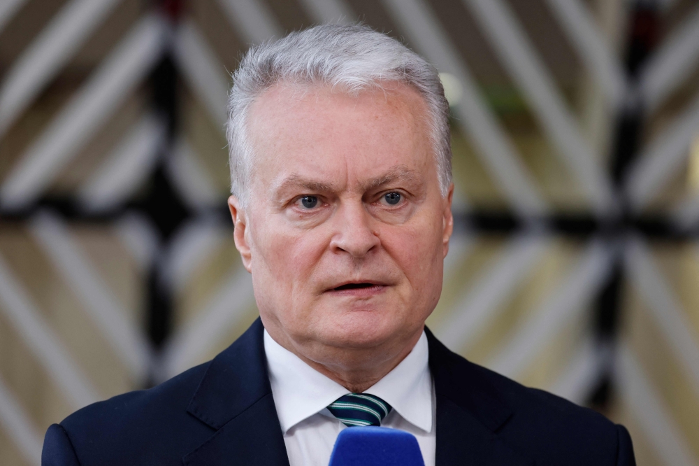 Lithuania's President Gitanas Nauseda speaks to the press as he arrives to attend a European Council summit at the EU headquarters in Brussels April 18, 2024. — AFP pic