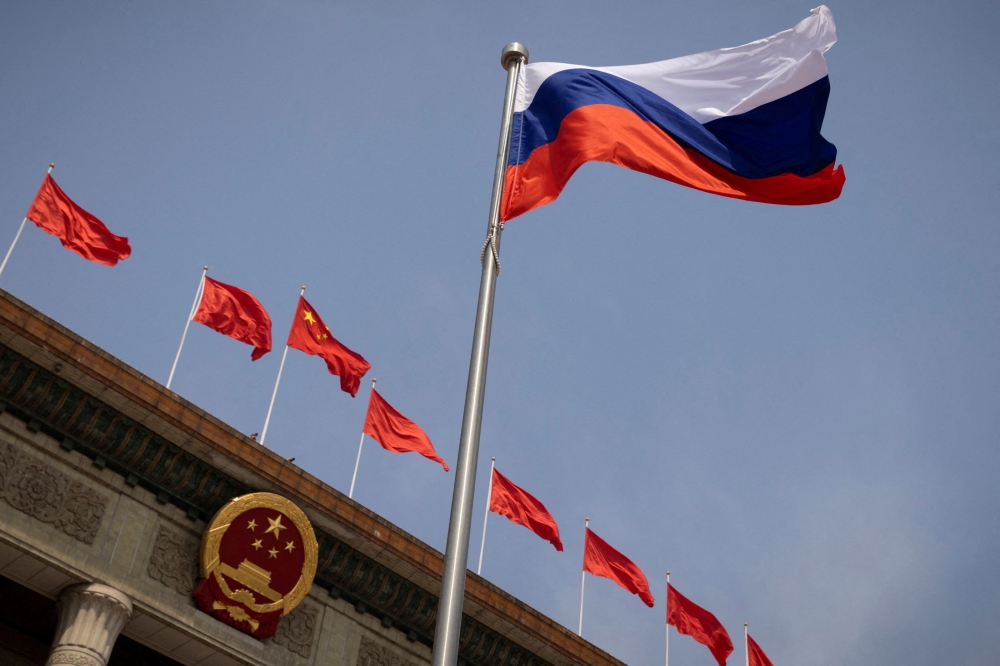 The Russian national flag flies in front of the Great Hall of the People in Beijing, China May 24, 2023. China’s top security official Chen Wenqing will visit Russia at the weekend and attend a gathering of counterparts from across the world, Beijing said today. ― Reuters pic