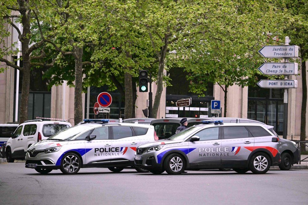 French police officers take part in a security perimiter near the consulate of Iran in Paris, as a person was suspected of entering the building with explosives April 19, 2024. — AFP pic