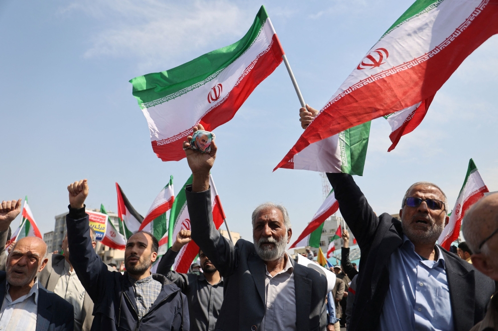 Iranians chant during an anti-Israel rally in Tehran, Iran April 19, 2024. ― Majid Asgaripour/WANA (West Asia News Agency) via Reuters
