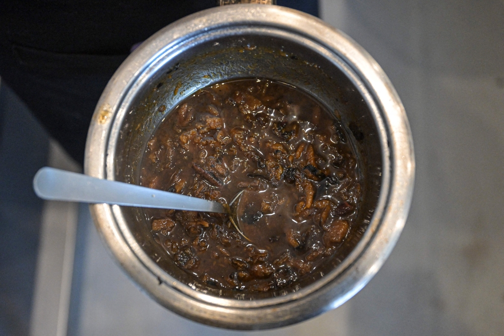 Melissa Castro prepares a dish using the peels, leaves, and stems of vegetables and fruits in a restaurant laboratory where a team of chefs and nutritionists investigate culinary techniques to optimise food in Lima April 11, 2024. — AFP pic
