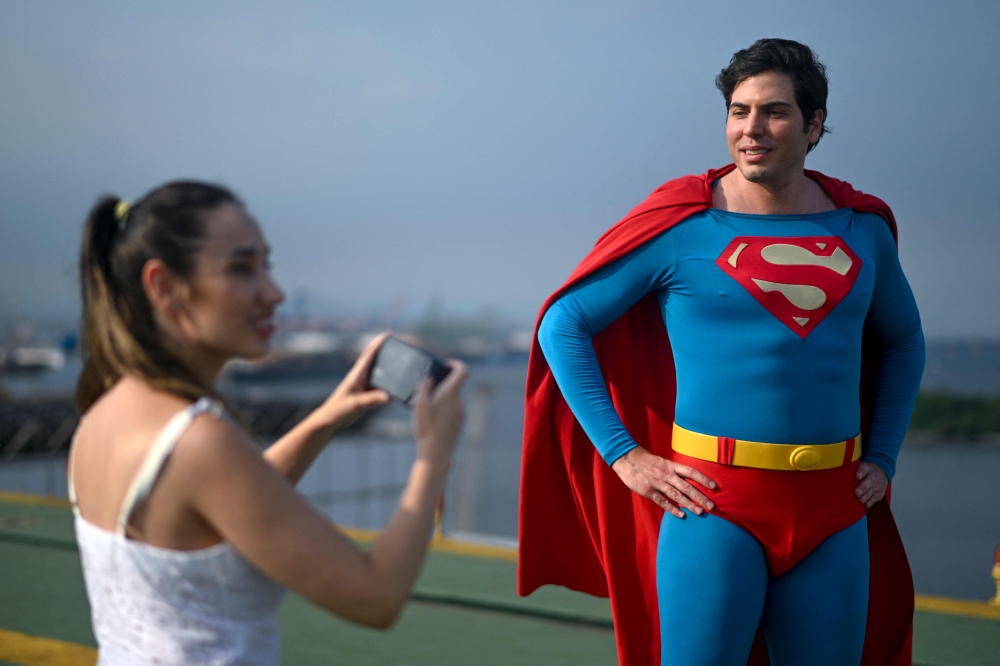 Leonardo Muylaert is recorded by his girlfriend Helenise Santos at the helipad of the National Institute of Traumatology and Orthopedics (INTO) in the city center of Rio de Janeiro March 18, 2024. — AFP pic