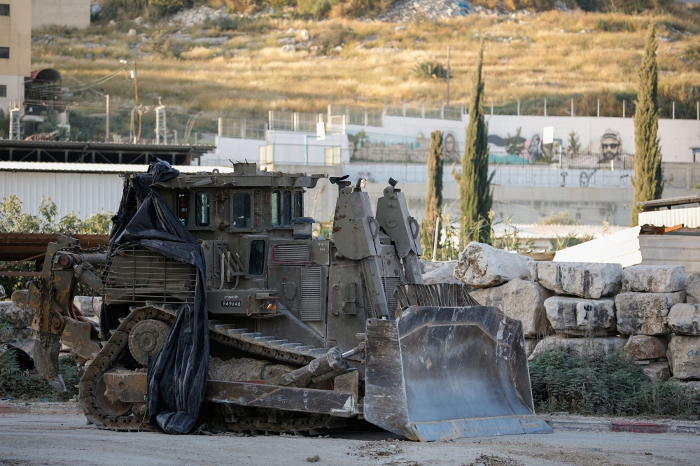 An Israeli army excavator is pictured in Tulkarm, in the Israeli-occupied West Bank, April 19, 2024. ― Reuters pic