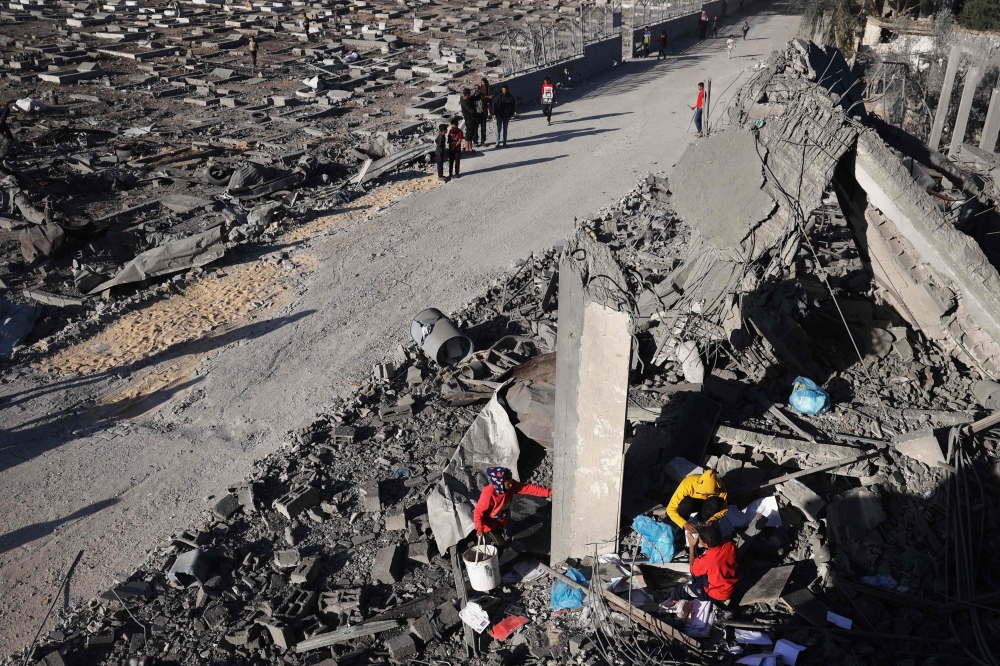 Palestinians salvage belongings from the rubble of a house hit by overnight Israeli bombing in Rafah in the southern Gaza Strip on April 20, 2024. — AFPpic