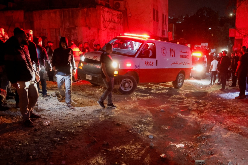 The Palestinian Red Crescent said yesterday at least 14 people had been killed in an Israeli raid on Nur Shams refugee camp in the north of the occupied West Bank. — Reuters pic