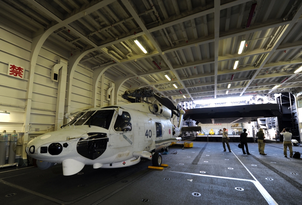 In this file photo taken on September 2, 2013 a Japanese Maritime Defence Forces’ SH-60K helicopter is seen on the DDH-181 Hyuga warship at Harumi pier in Tokyo. — AFP file pic