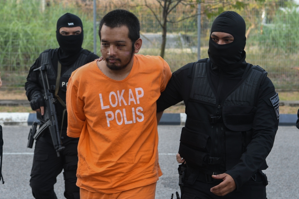 The suspect in the shooting case at KLIA is seen being brought to the Magistrate’s Court in Kota Baru April 22, 2024. — Bernama pic
