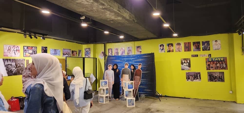 Life-size standees of CNBLUE members wearing full baju melayu by fans in the spirit of  Hari Raya. — Picture by Arif Zikri