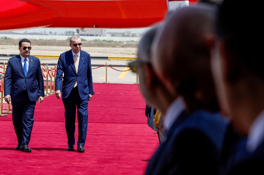 Iraqi Prime Minister Mohammed Shia al-Sudani and Turkish President Tayyip Erdogan attend a welcoming ceremony at Baghdad International Airport, in Baghdad, Iraq April 22, 2024. — Reuters pic