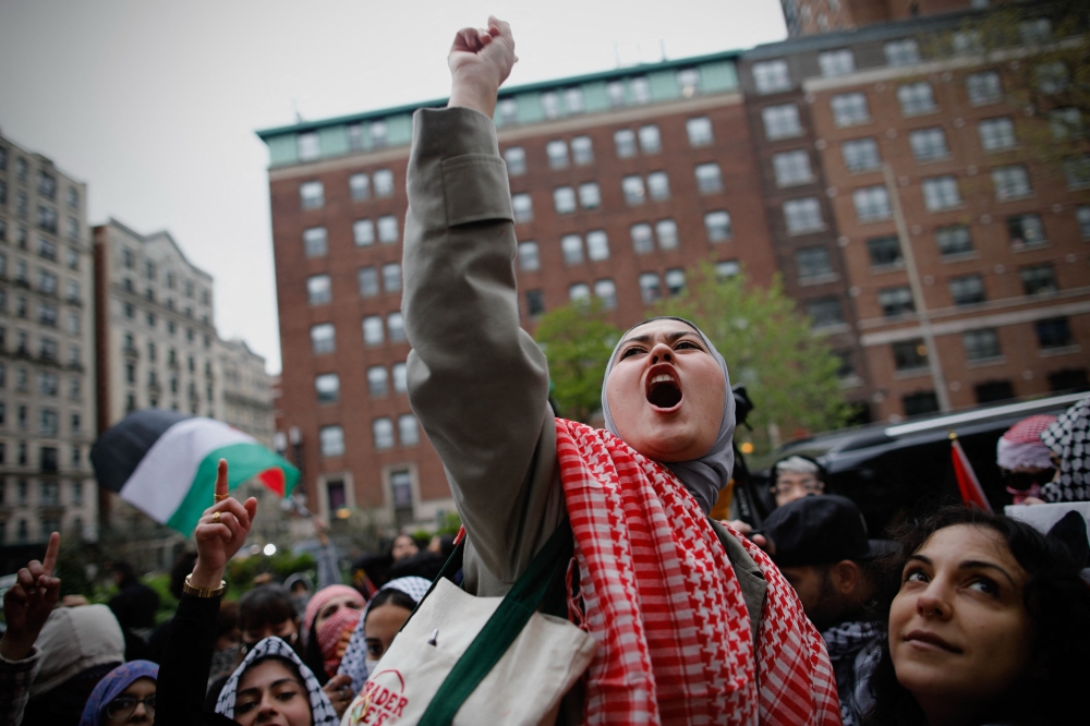 Pro-Palestinian protesters gather outside of Columbia University in New York City April 18, 2024. — AFP pic